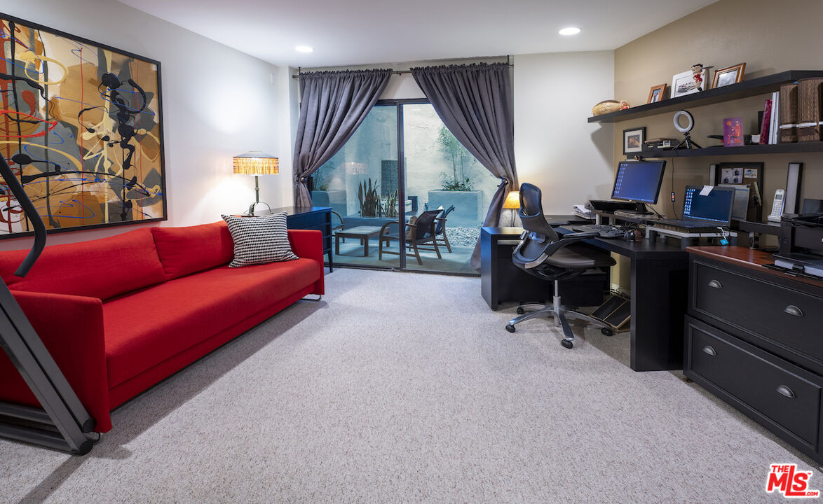 11687 Bellagio Road, Unit 3 Los Angeles, CA 90049 - Photo 23 of 31 a view of a livingroom with workspace and a couch