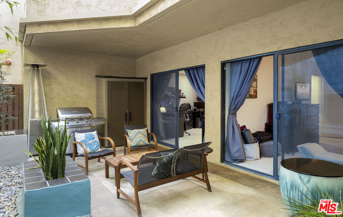 11687 Bellagio Road, Unit 3 Los Angeles, CA 90049 - Photo 24 of 31 a living room with furniture and a potted plant