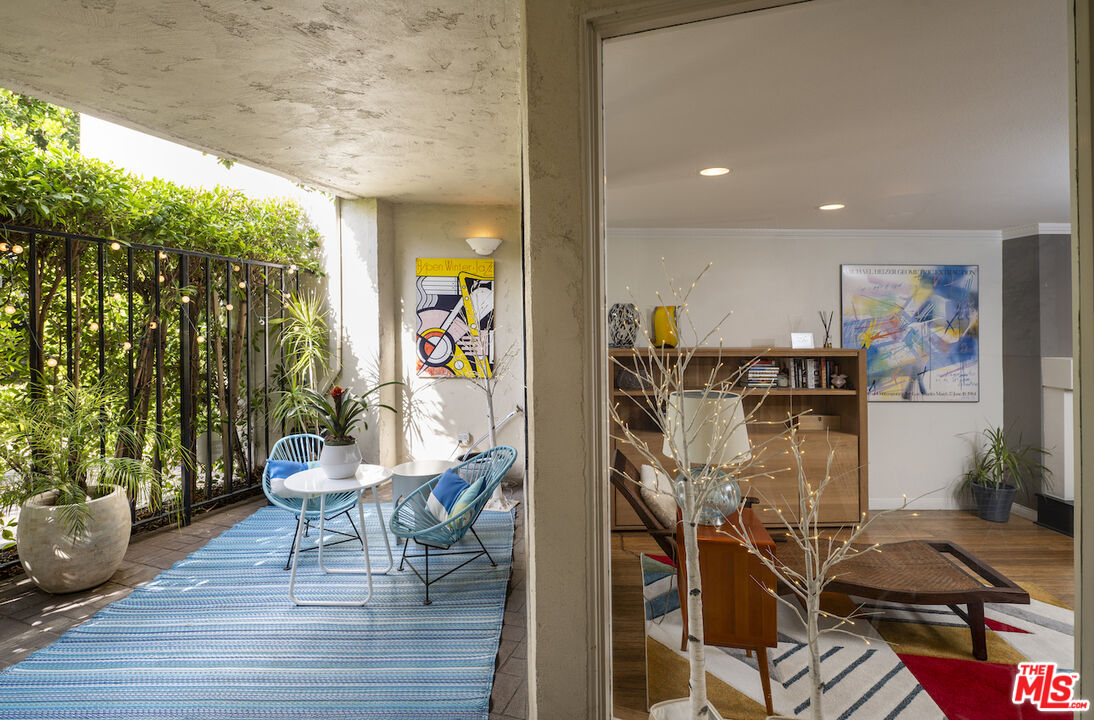 11687 Bellagio Road, Unit 3 Los Angeles, CA 90049 - Photo 4 of 31 a view of a entryway with furniture and wooden floor