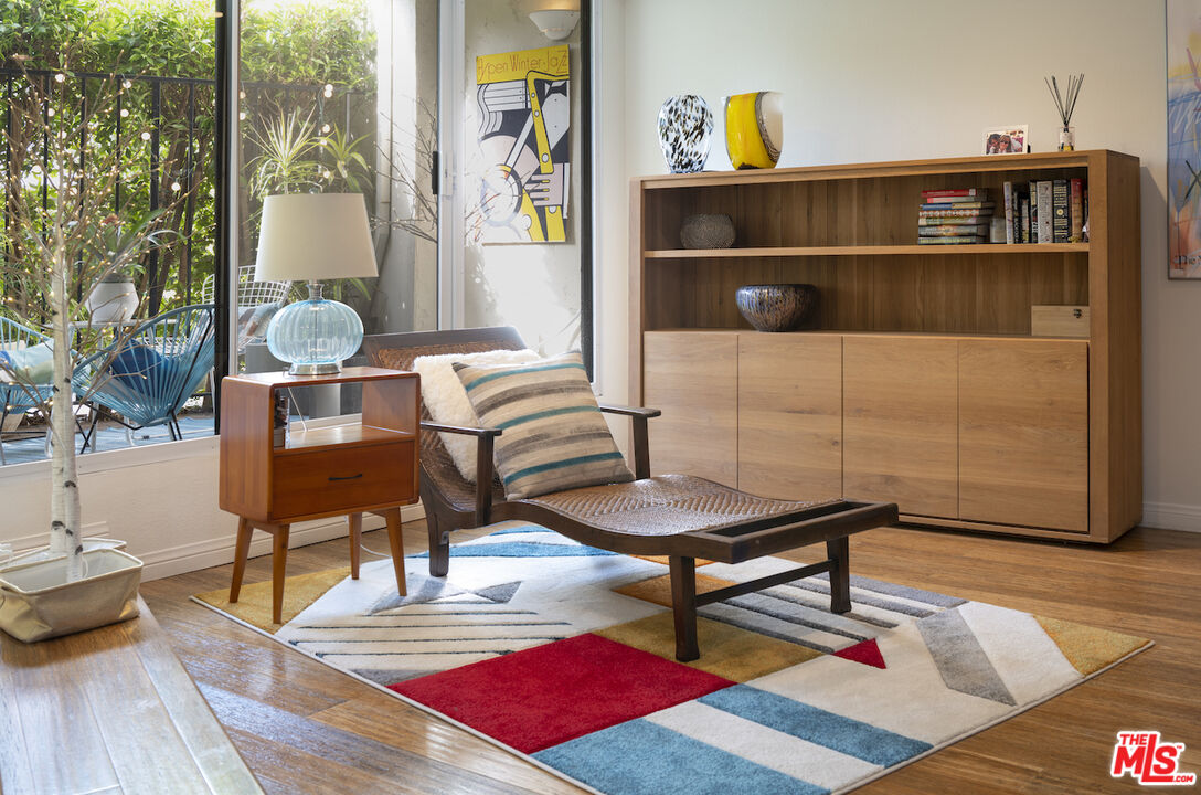 11687 Bellagio Road, Unit 3 Los Angeles, CA 90049 - Photo 6 of 31 a living room with furniture and wooden floor