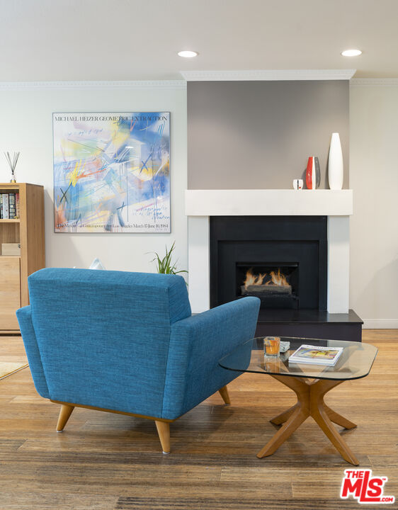 11687 Bellagio Road, Unit 3 Los Angeles, CA 90049 - Photo 8 of 31 a living room with furniture and a fireplace