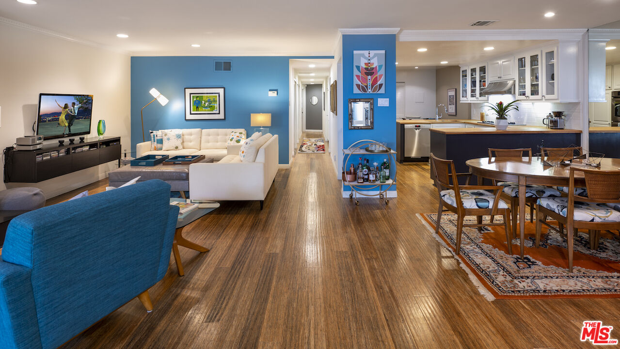 11687 Bellagio Road, Unit 3 Los Angeles, CA 90049 - Photo 9 of 31 a living room with furniture and a flat screen tv