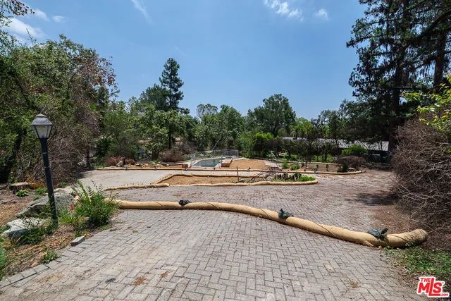 a view of swimming pool with sitting area