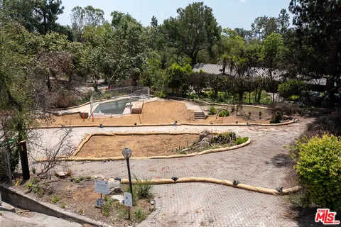 a view of a swimming pool with a yard