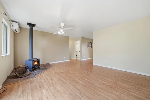 a kitchen with a stove a sink and a microwave