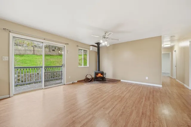 a kitchen with stainless steel appliances granite countertop a stove and a refrigerator