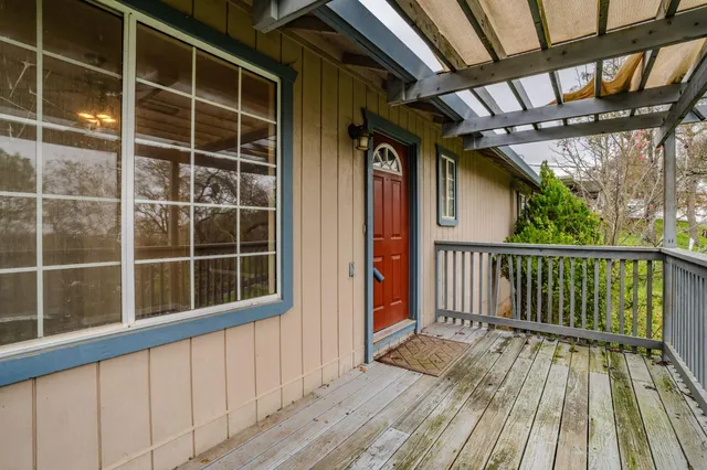 a view of balcony with wooden floor