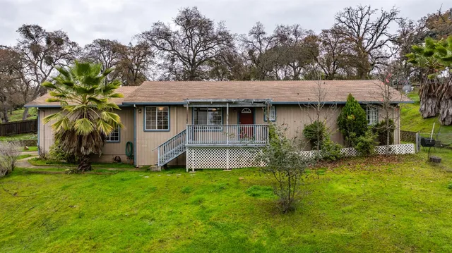 a front view of house with garden