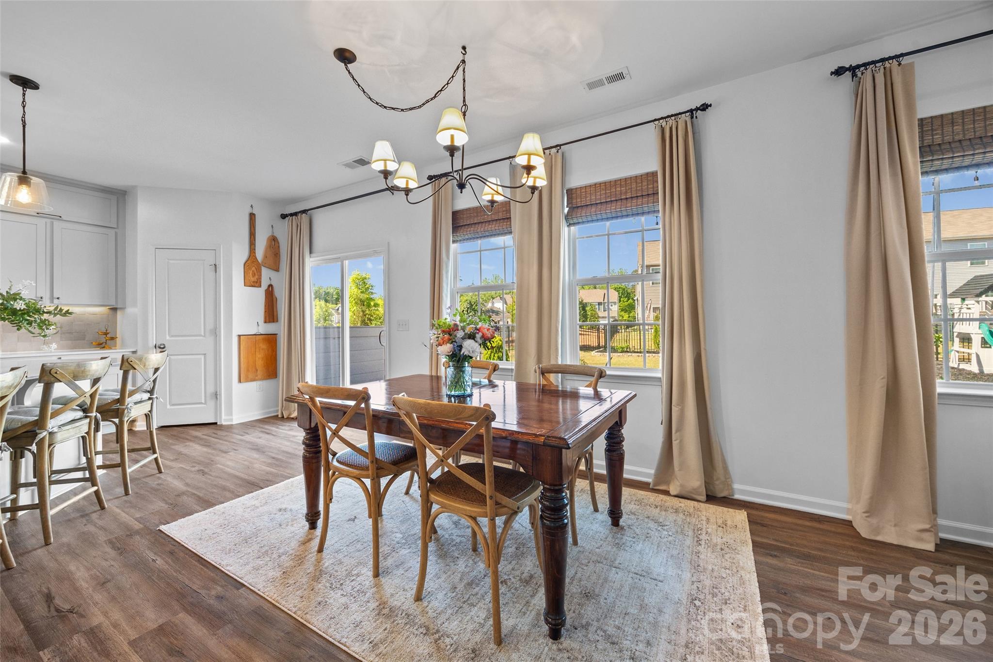 138 Lambeth Loop Mooresville, NC 28115 - Photo 17 of 48 a view of a dining room with furniture window and wooden floor
