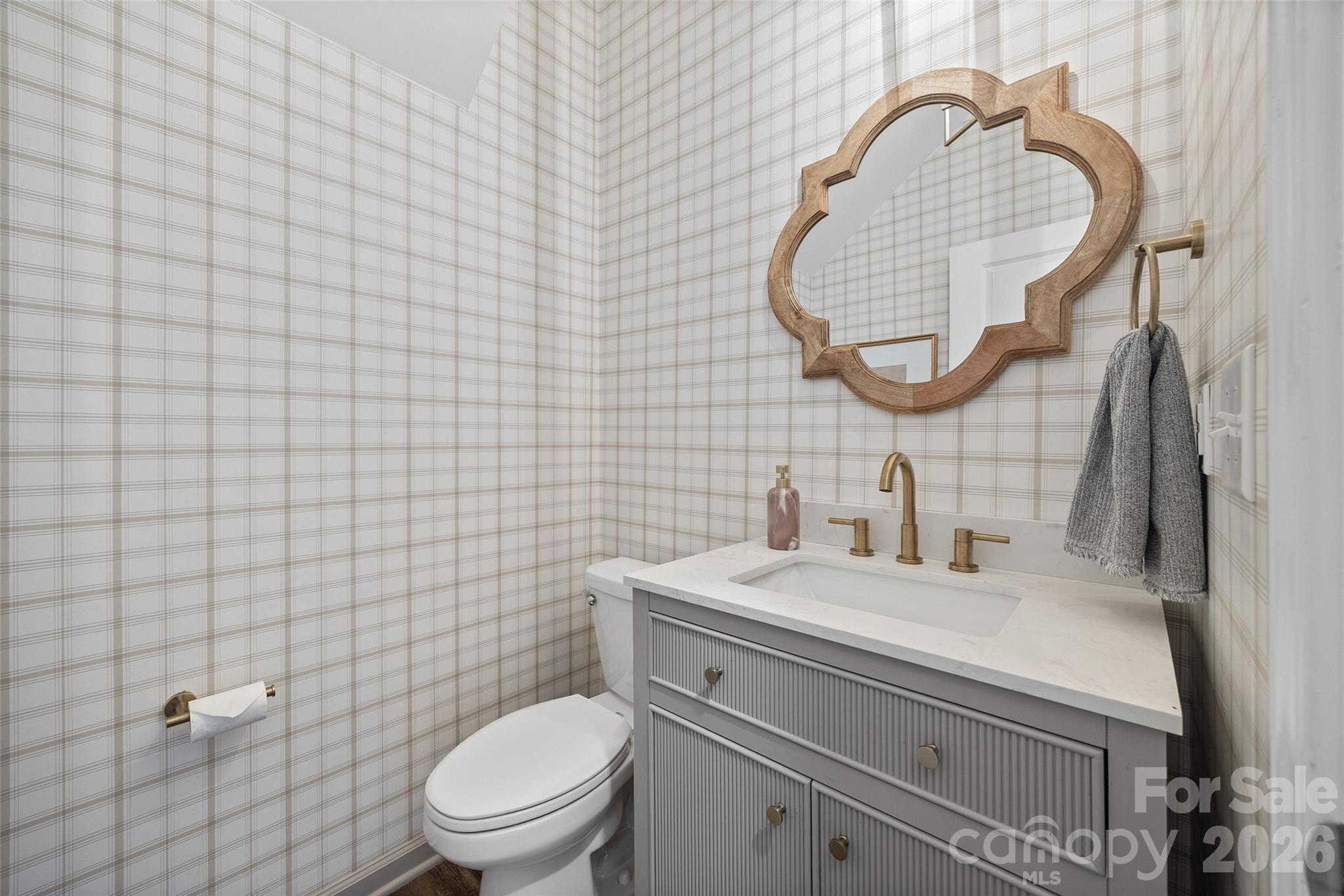 138 Lambeth Loop Mooresville, NC 28115 - Photo 18 of 48 a bathroom with a sink a toilet and a mirror