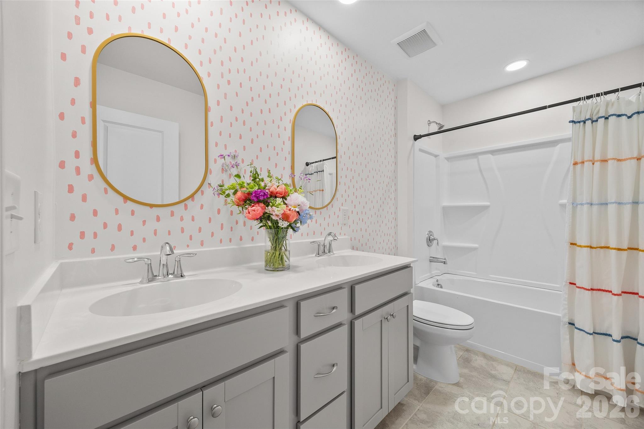 138 Lambeth Loop Mooresville, NC 28115 - Photo 25 of 48 a bathroom with a granite countertop sink a toilet a mirror and shower