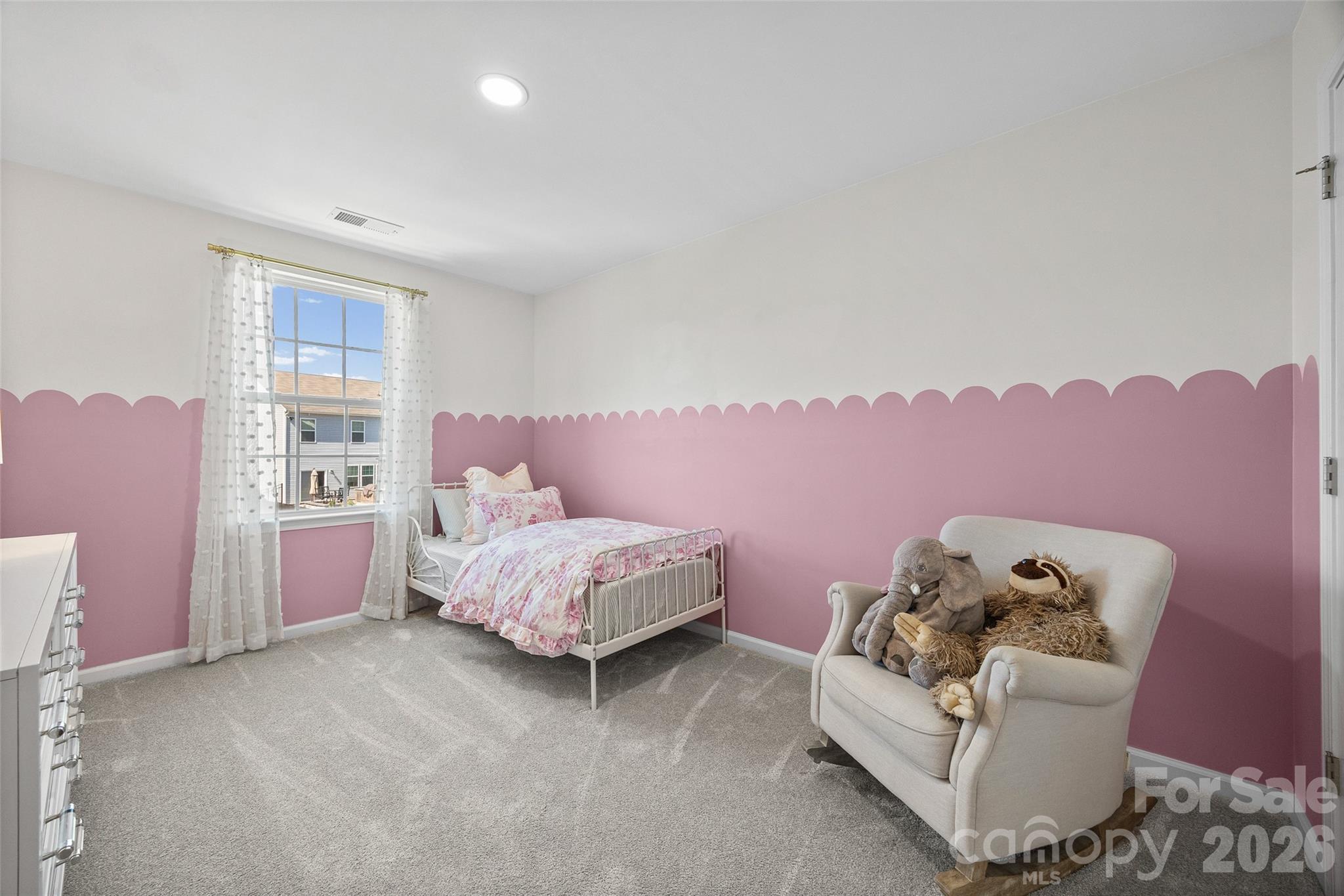 138 Lambeth Loop Mooresville, NC 28115 - Photo 26 of 48 a spacious bedroom with a bed and a couch