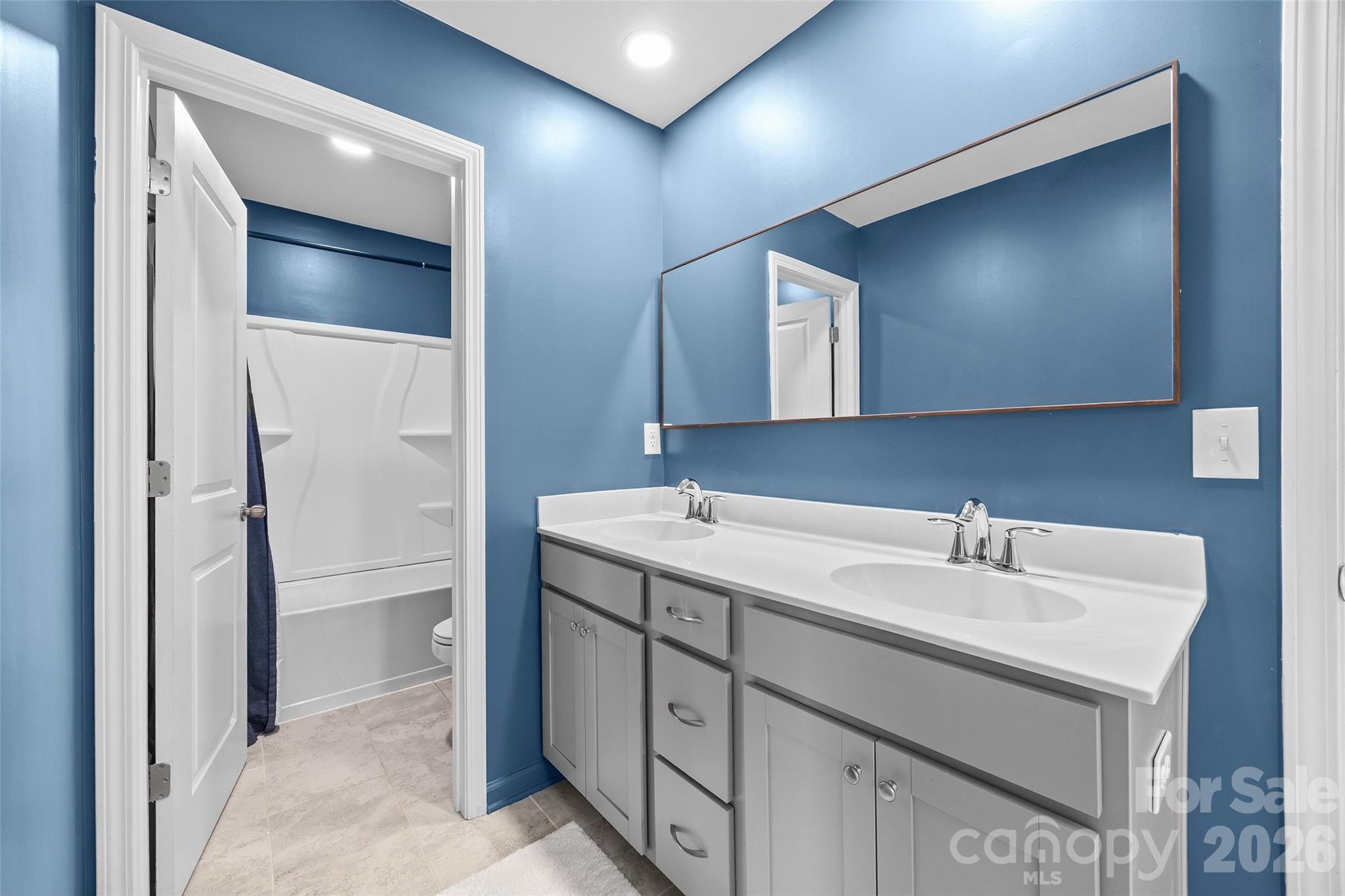 138 Lambeth Loop Mooresville, NC 28115 - Photo 28 of 48 a bathroom with a sink and a mirror