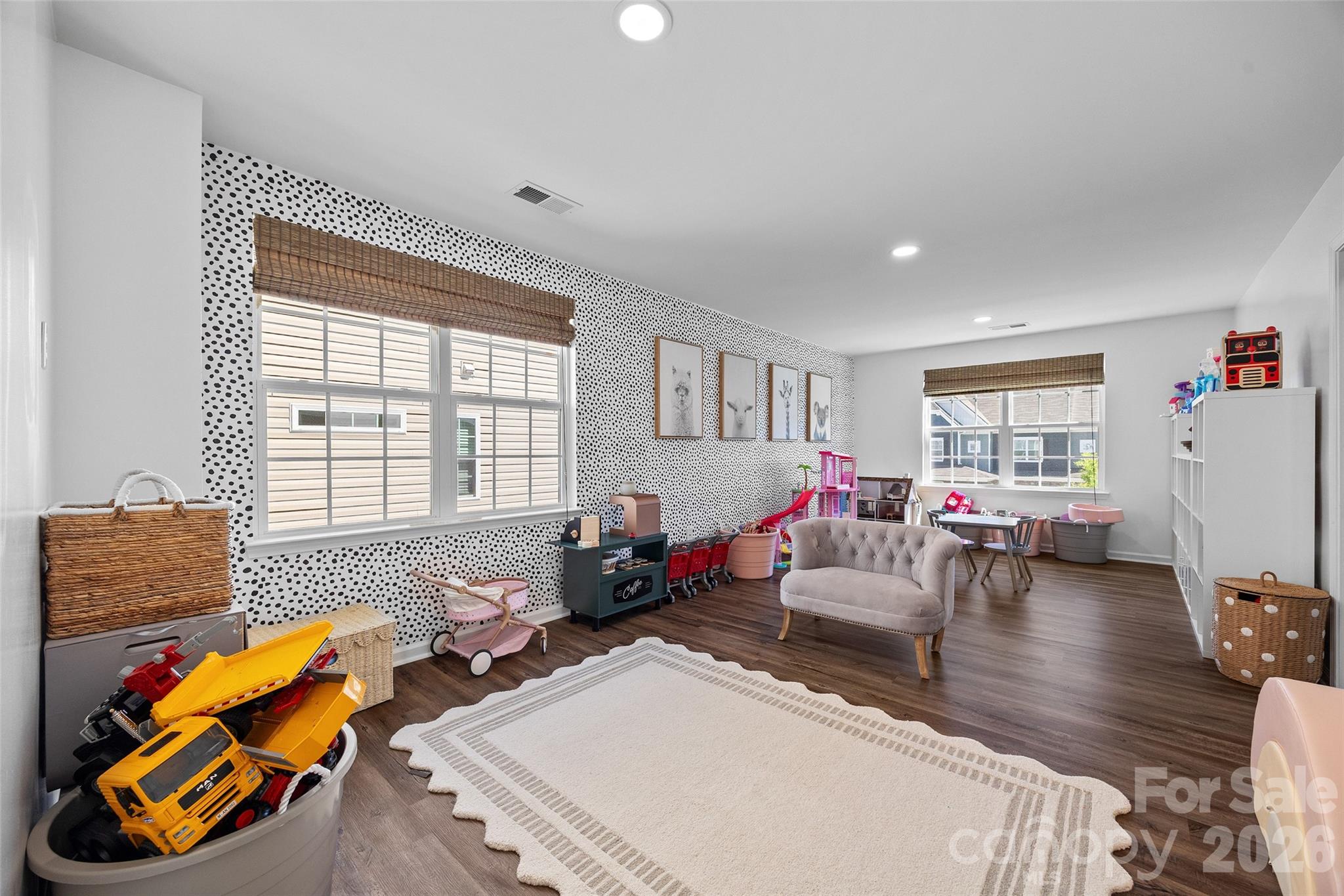 138 Lambeth Loop Mooresville, NC 28115 - Photo 29 of 48 a living room with furniture a flat screen tv and a large window