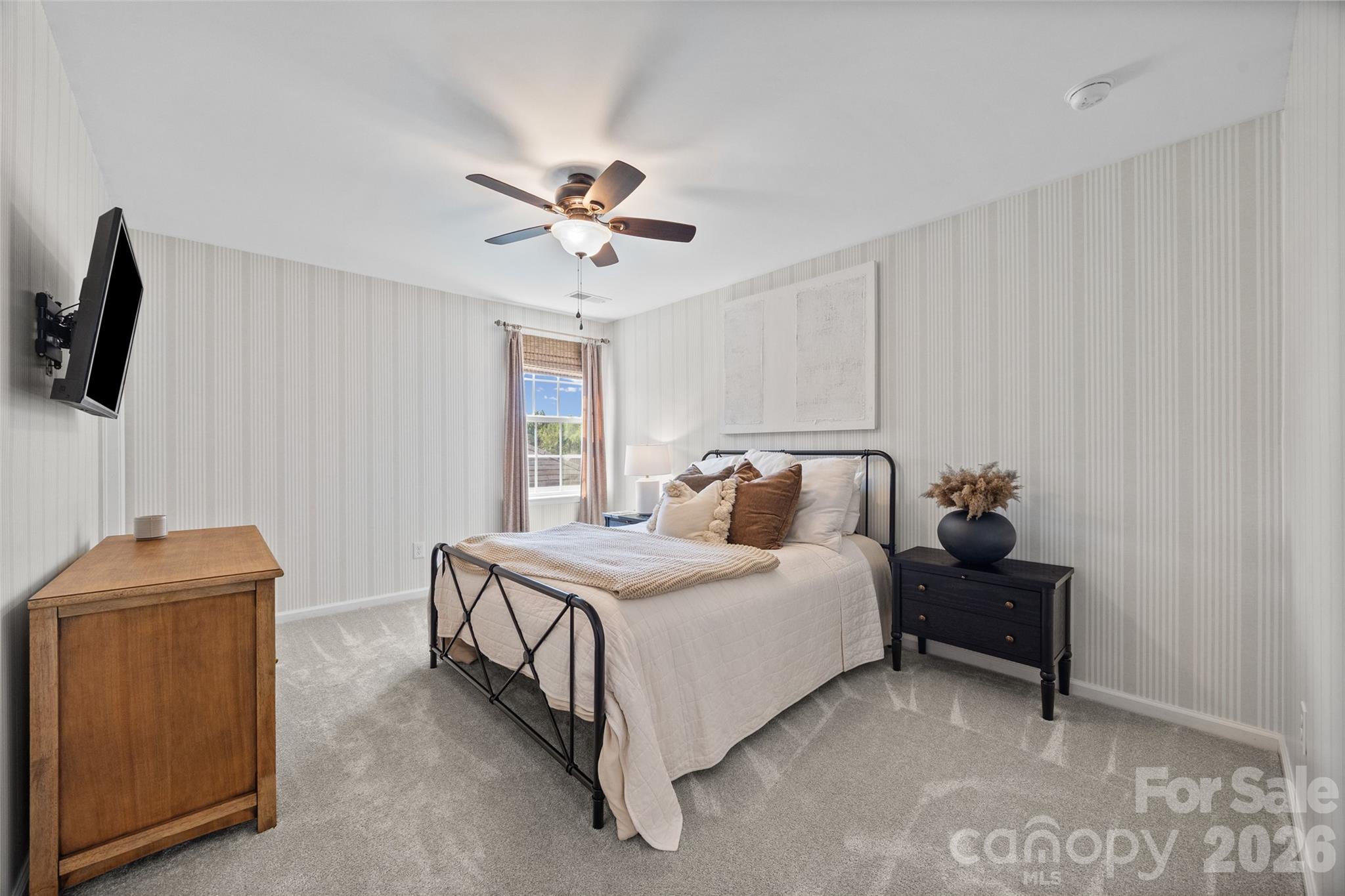 138 Lambeth Loop Mooresville, NC 28115 - Photo 35 of 48 a bedroom with a bed and a chandelier