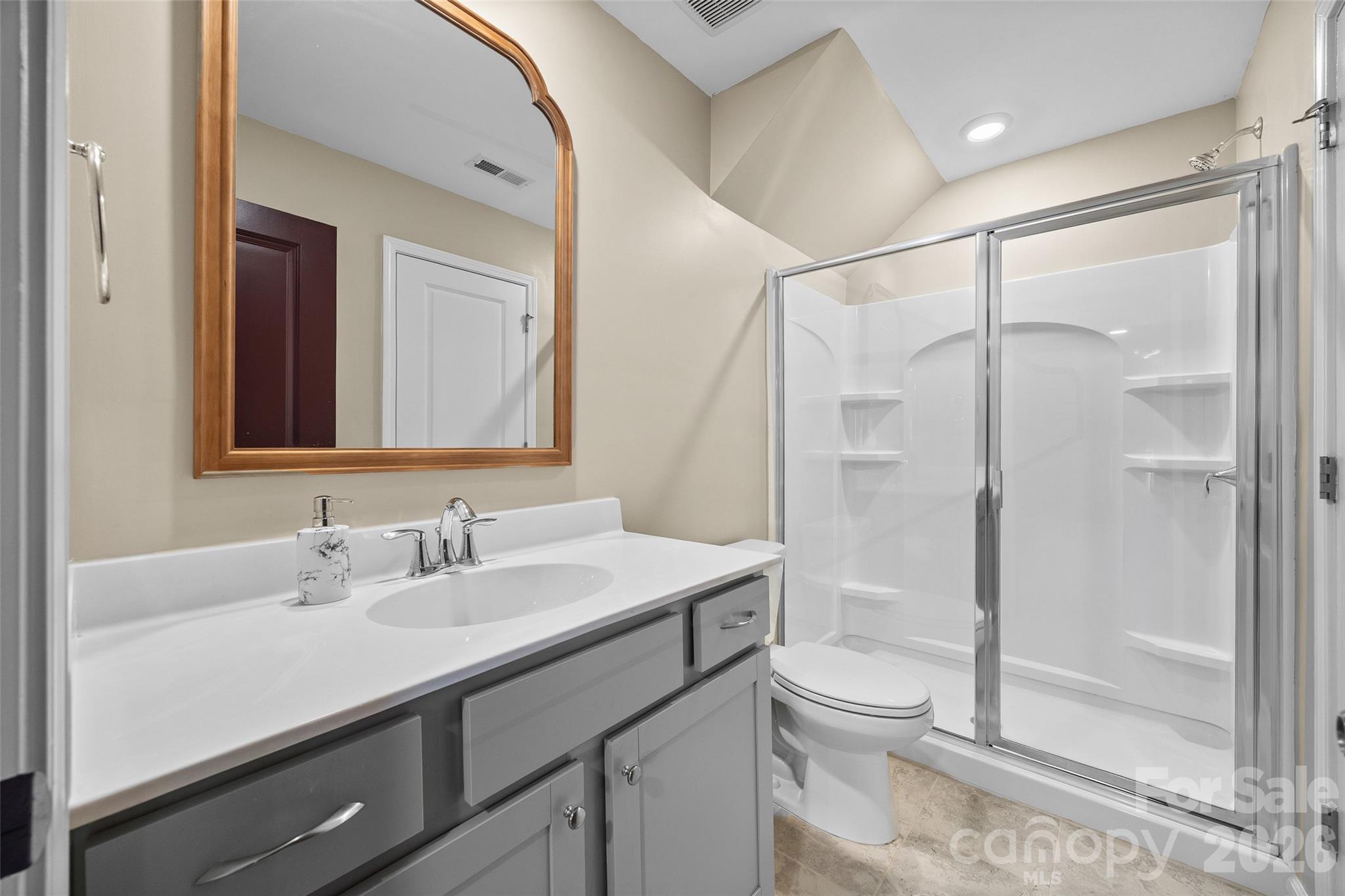 138 Lambeth Loop Mooresville, NC 28115 - Photo 36 of 48 a bathroom with a shower sink vanity mirror and toilet