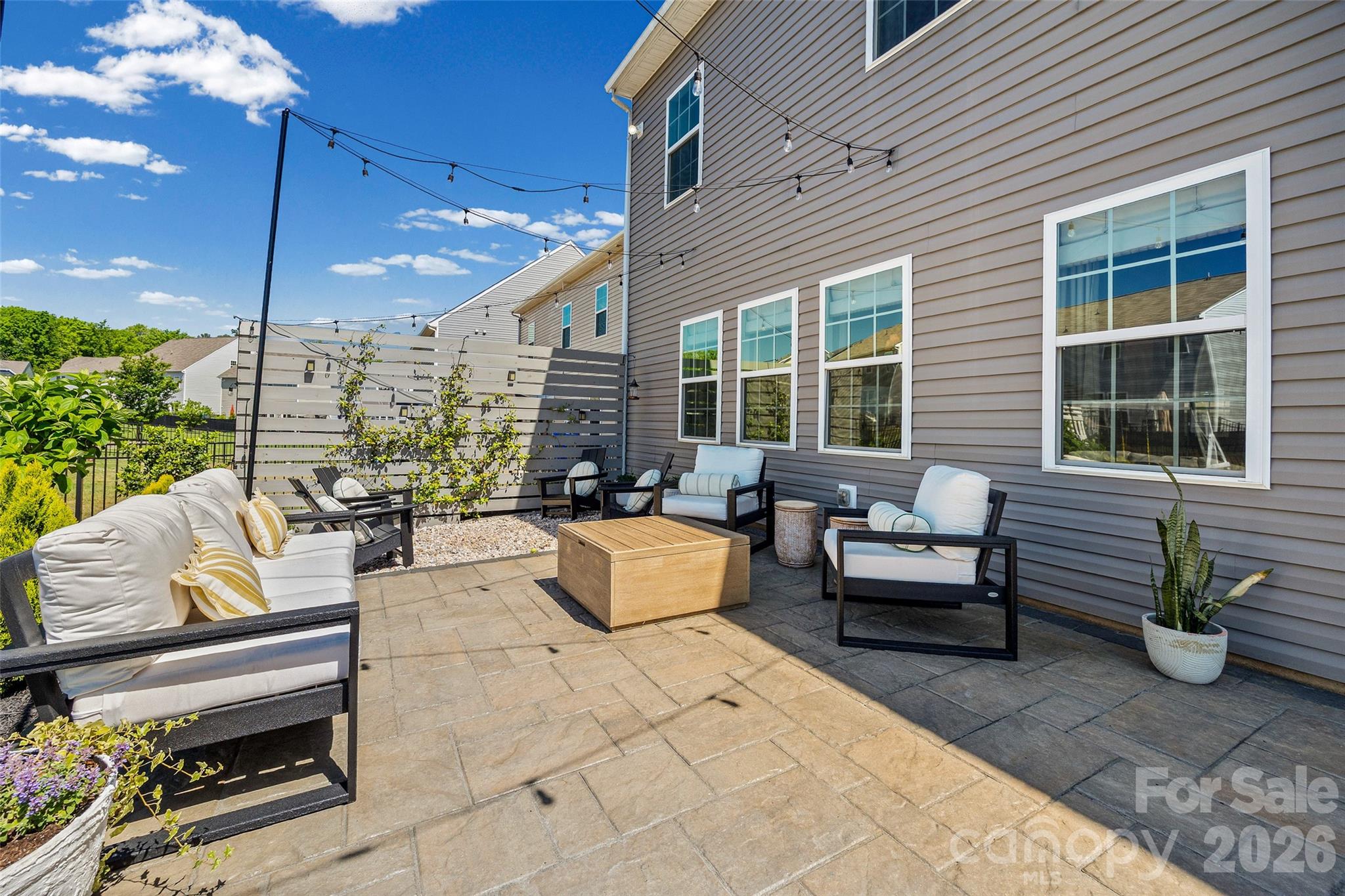 138 Lambeth Loop Mooresville, NC 28115 - Photo 41 of 48 a building outdoor space with patio furniture and potted plants