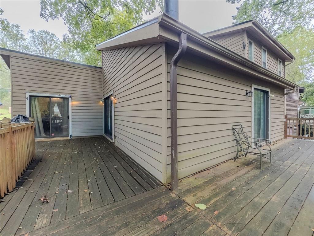 2829 Cardinal Trace Duluth, GA 30096 - Photo 11 of 11 a view of a white house with a patio and a yard
