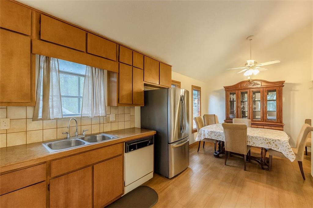2829 Cardinal Trace Duluth, GA 30096 - Photo 7 of 11 a kitchen with stainless steel appliances granite countertop a refrigerator and a sink