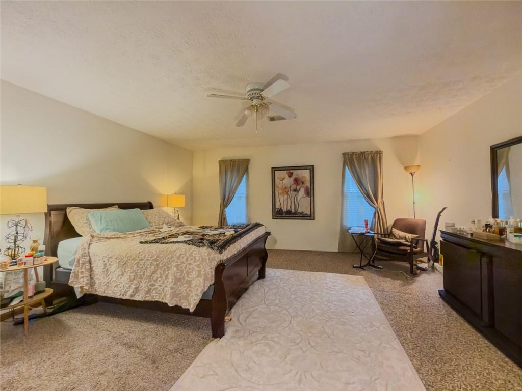 2829 Cardinal Trace Duluth, GA 30096 - Photo 9 of 11 a bedroom with bed couch and window