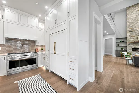 a kitchen with stainless steel appliances a stove and a refrigerator