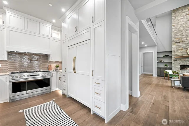 a kitchen with stainless steel appliances a stove and a refrigerator