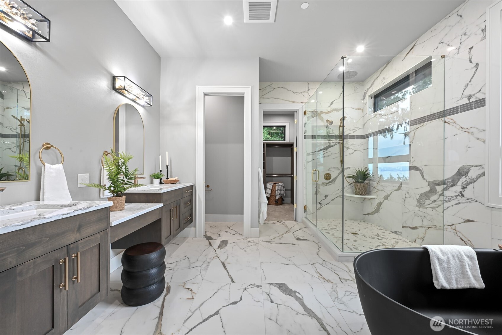555 Whitecap Road Bellingham, WA 98229 - Photo 25 of 40 a spacious bathroom with a granite countertop sink a mirror and shower