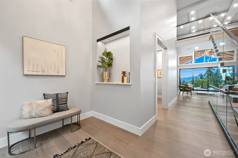 a view of a hallway with couch and dining table