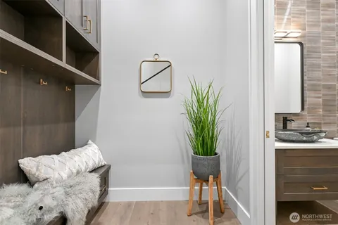 a living room with furniture and a potted plant