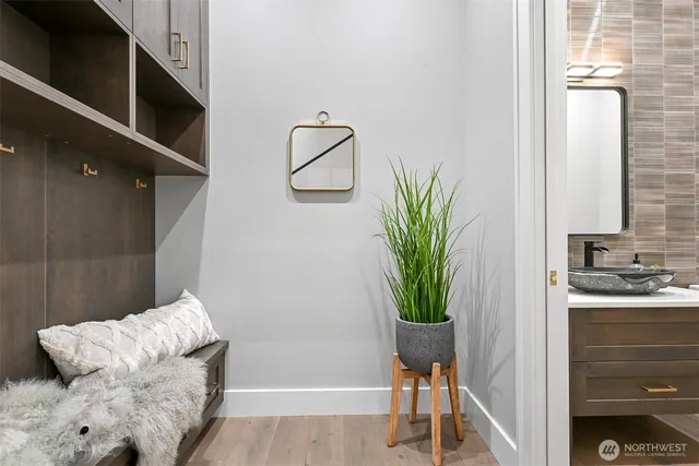 a living room with furniture and a potted plant