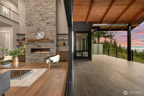 a view of a patio with a table and chairs next to a yard