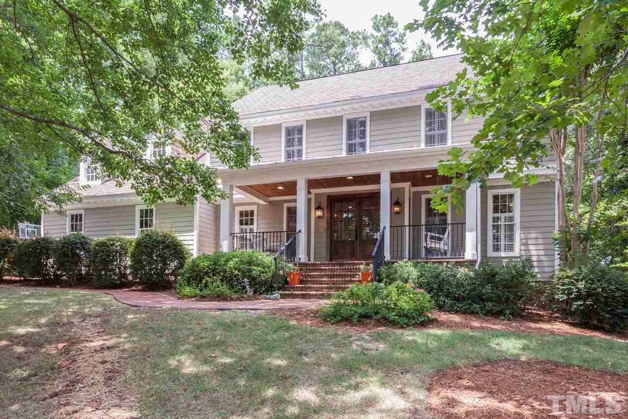 2425 Coley Forest Place Raleigh, NC 27612 - Photo 1 of 24 a front view of a house with yard and green space