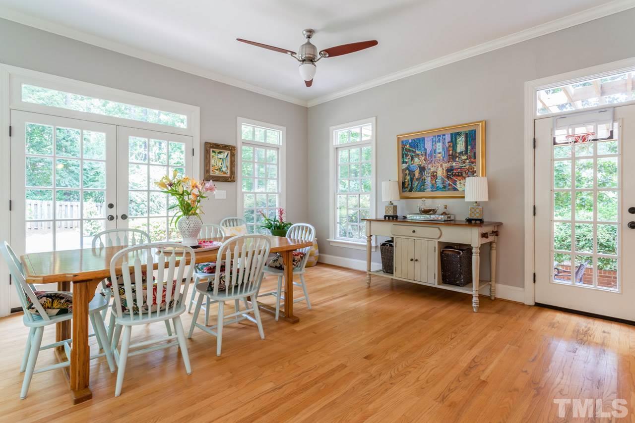 2425 Coley Forest Place Raleigh, NC 27612 - Photo 2 of 24 a view of a dining room with furniture window and wooden floor