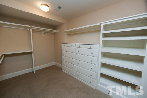 2425 Coley Forest Place Raleigh, NC 27612 - Photo 11 of 24 a view of an empty walk in closet