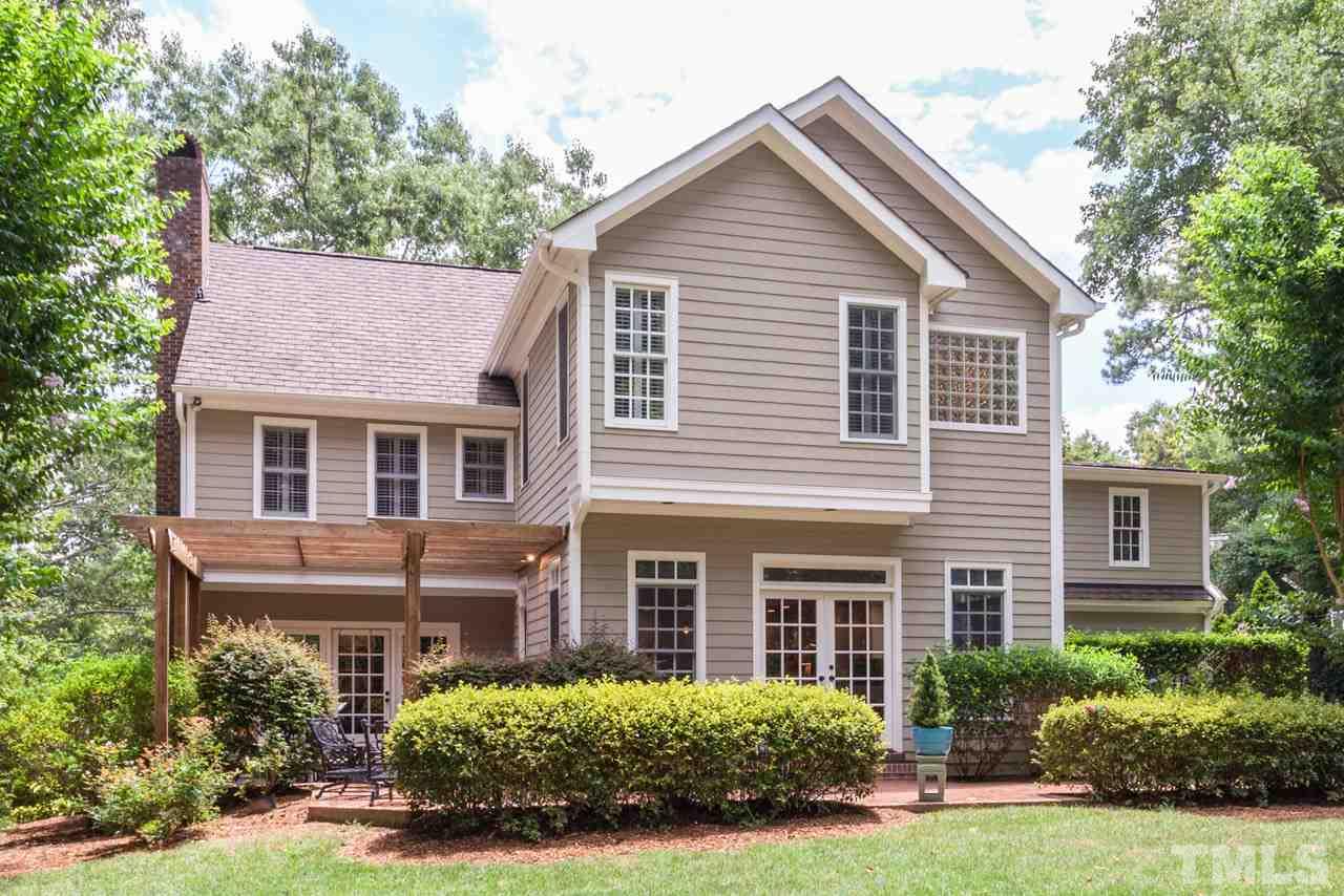 2425 Coley Forest Place Raleigh, NC 27612 - Photo 21 of 24 front view of a house and a yard