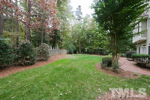 2425 Coley Forest Place Raleigh, NC 27612 - Photo 22 of 24 a view of a backyard with a garden