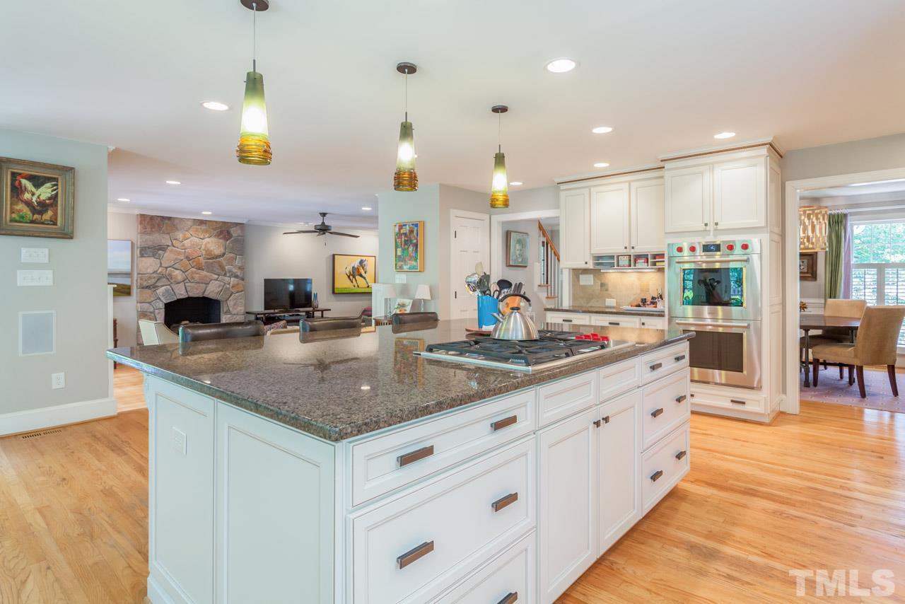 2425 Coley Forest Place Raleigh, NC 27612 - Photo 5 of 24 a kitchen with counter top space cabinets and appliances