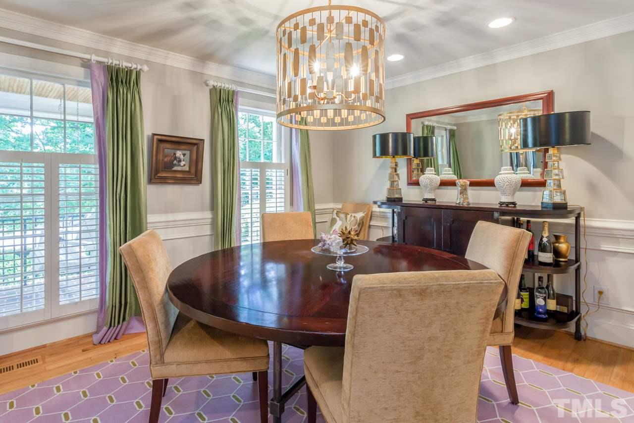 2425 Coley Forest Place Raleigh, NC 27612 - Photo 8 of 24 a view of a dining room with furniture window and wooden floor