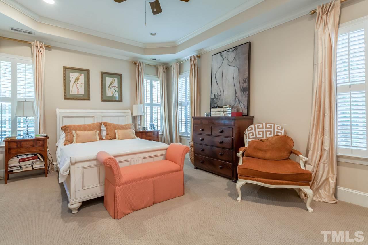 2425 Coley Forest Place Raleigh, NC 27612 - Photo 9 of 24 a bedroom with furniture and a window