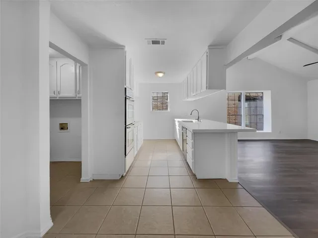 a view of kitchen with furniture and wooden floor
