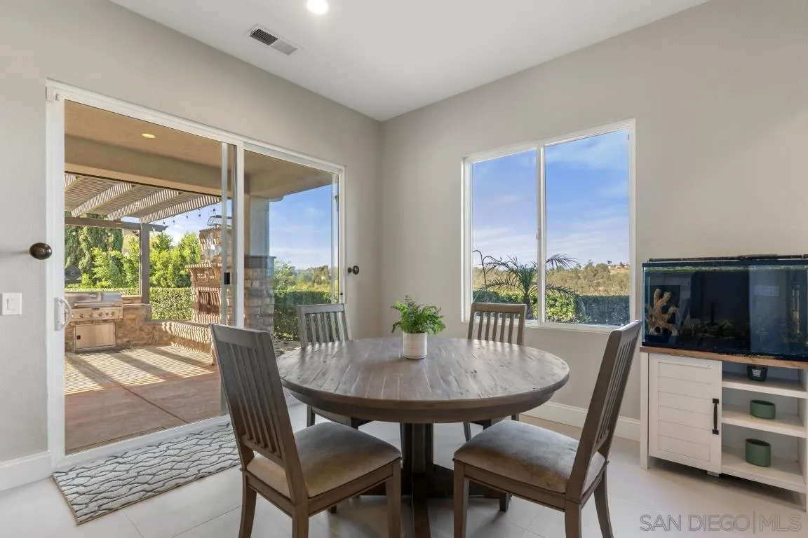 310 Highland Oaks Court Fallbrook, CA 92028 - Photo 12 of 52 a view of a dining room with furniture window and outside view