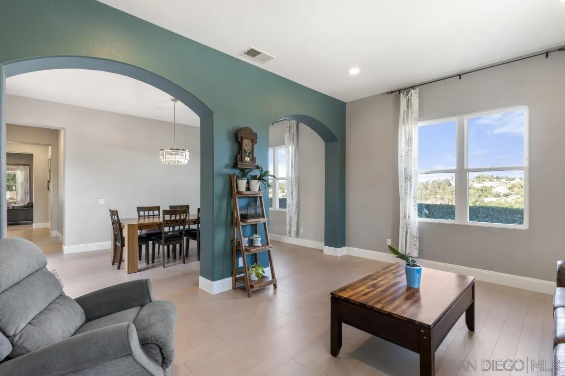 310 Highland Oaks Court Fallbrook, CA 92028 - Photo 16 of 52 a living room with furniture and a large window