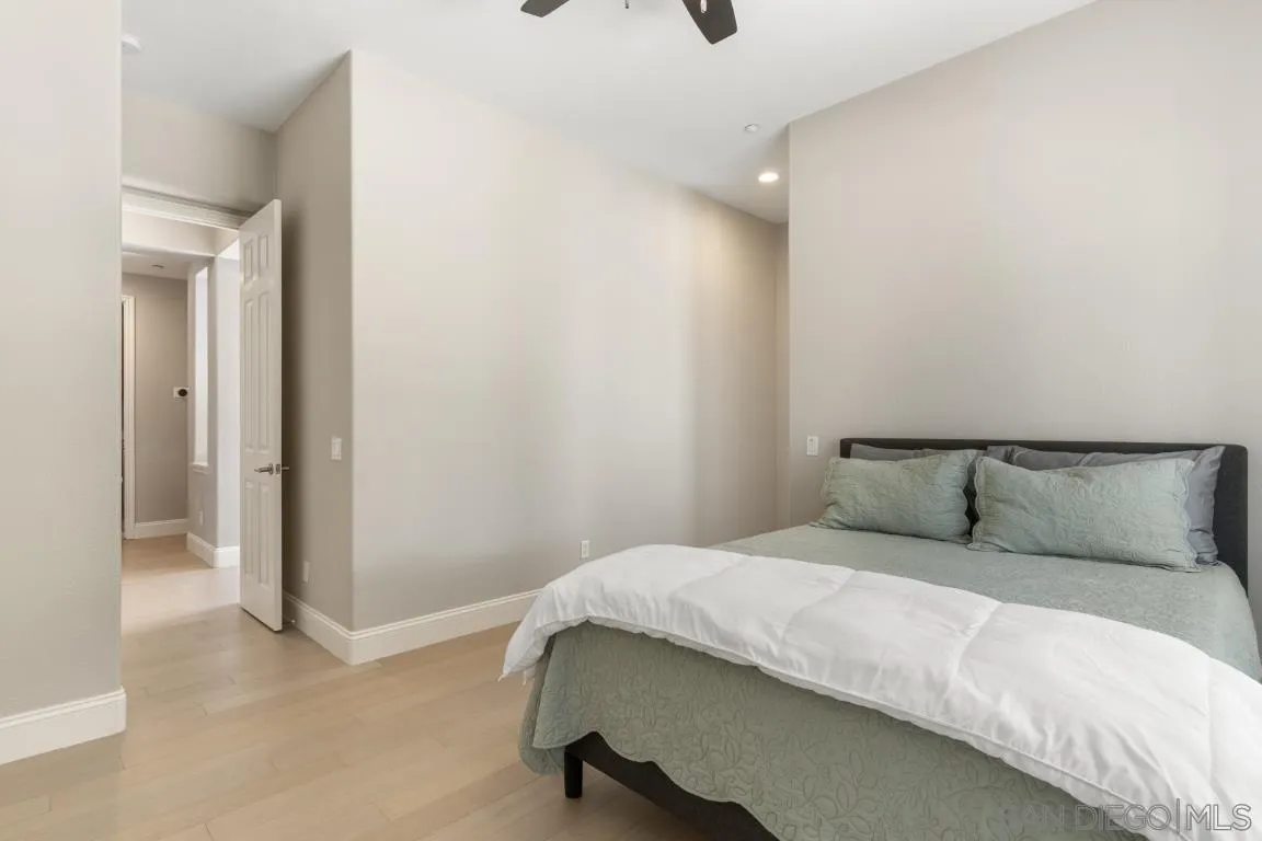 310 Highland Oaks Court Fallbrook, CA 92028 - Photo 22 of 52 a bedroom with a bed and a cabinets