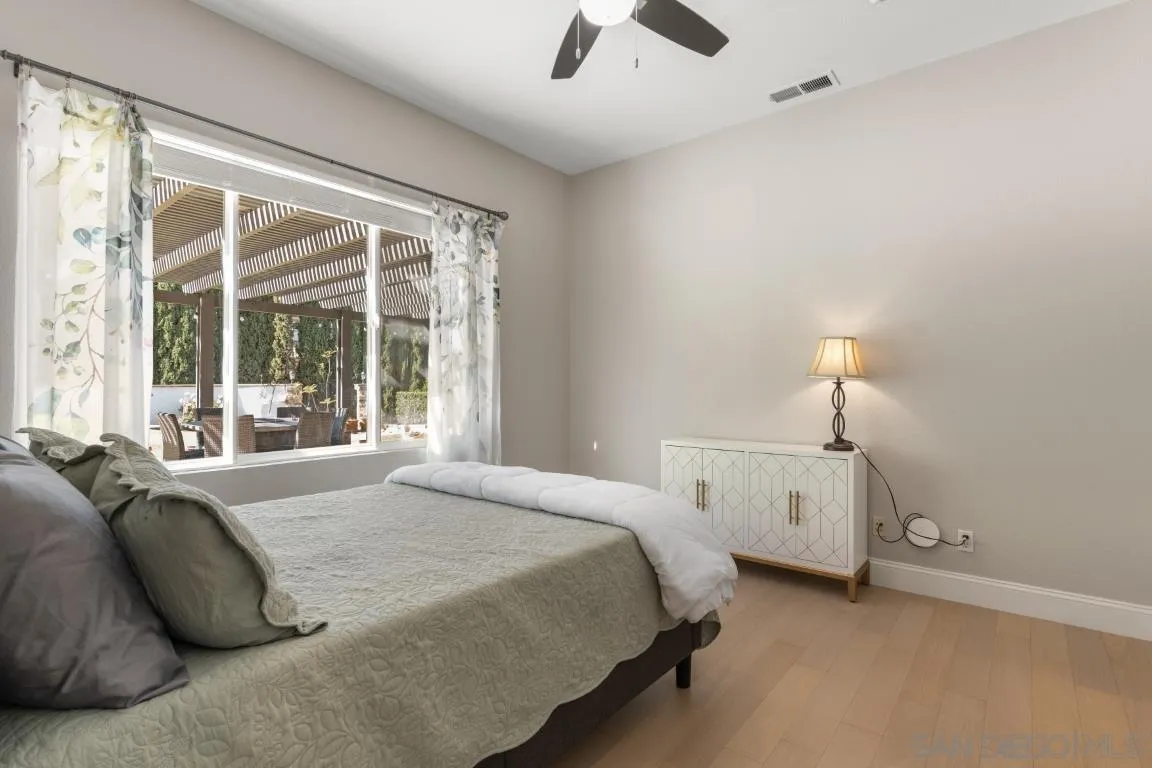 310 Highland Oaks Court Fallbrook, CA 92028 - Photo 23 of 52 a bedroom with bed and window