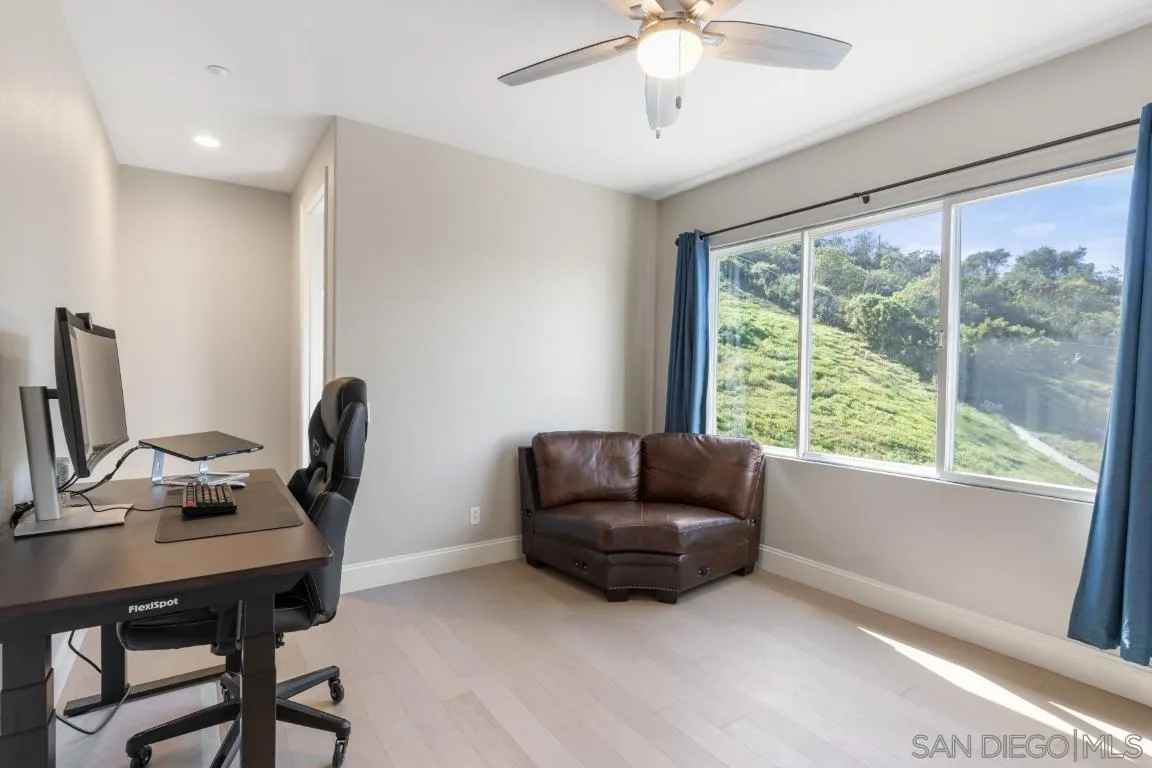 310 Highland Oaks Court Fallbrook, CA 92028 - Photo 37 of 52 a livingroom with workspace and a window