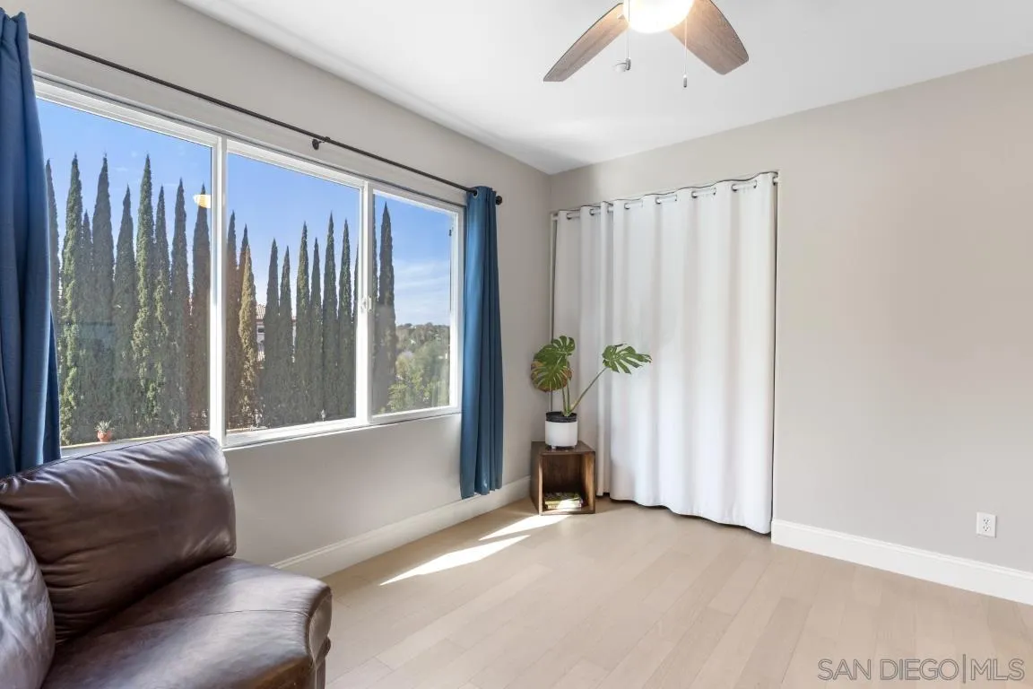 310 Highland Oaks Court Fallbrook, CA 92028 - Photo 38 of 52 a living room with furniture and a large window