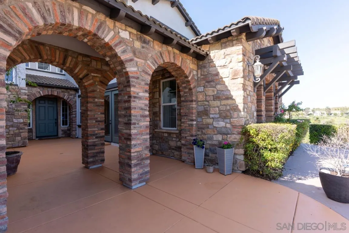 310 Highland Oaks Court Fallbrook, CA 92028 - Photo 47 of 52 a view of a porch with potted plants