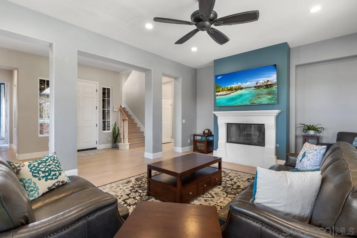 310 Highland Oaks Court Fallbrook, CA 92028 - Photo 5 of 52 a living room with furniture and a fireplace