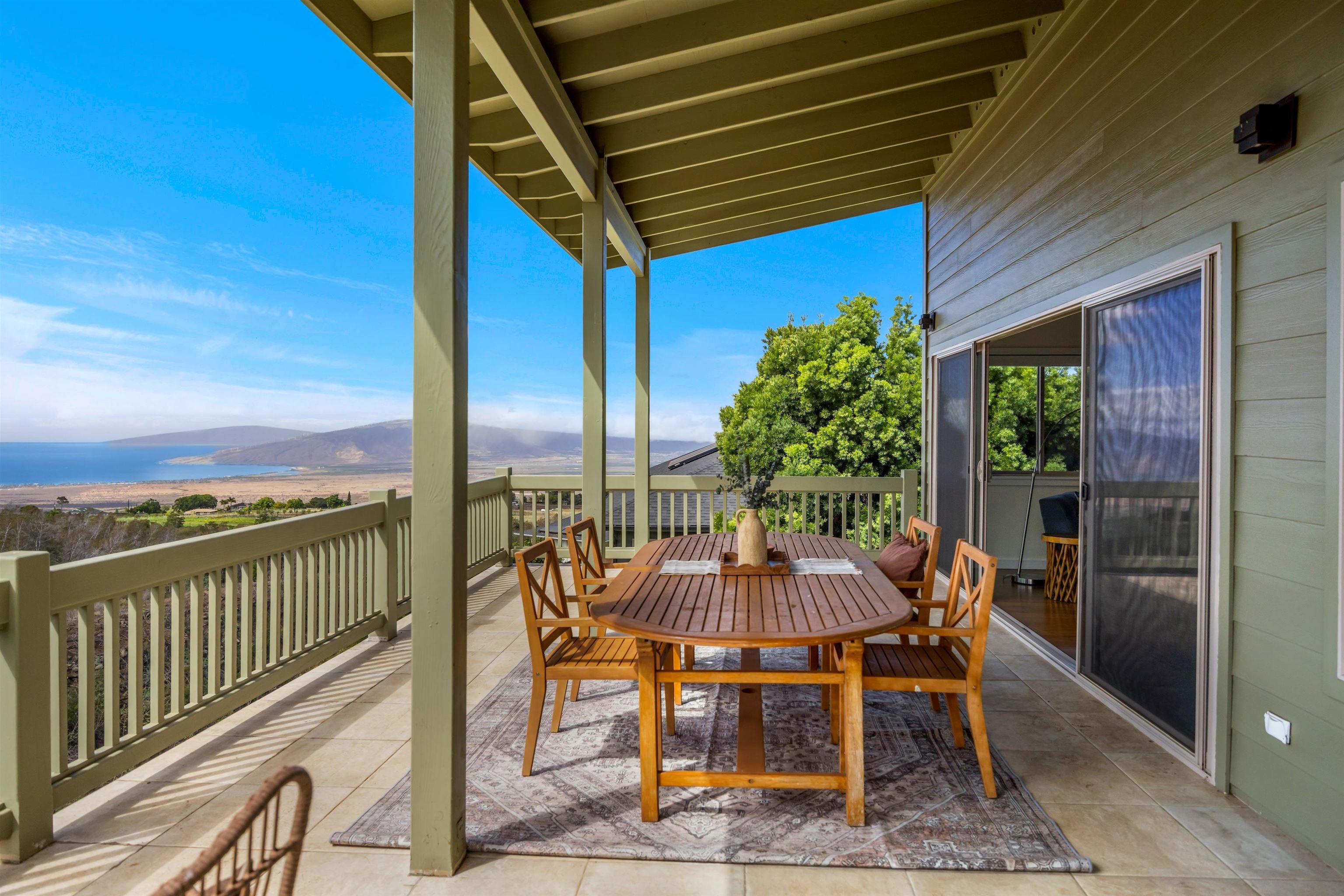 183 Kulamanu Circle Kula, HI 96790 - Photo 11 of 42 a view of a balcony with furniture and a floor to ceiling window