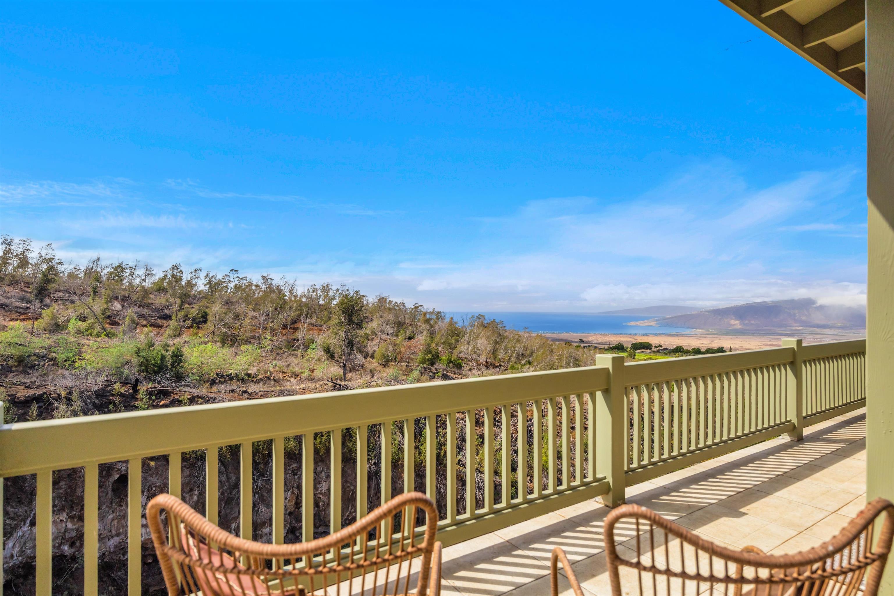 183 Kulamanu Circle Kula, HI 96790 - Photo 12 of 42 a view of a balcony with wooden floor and fence